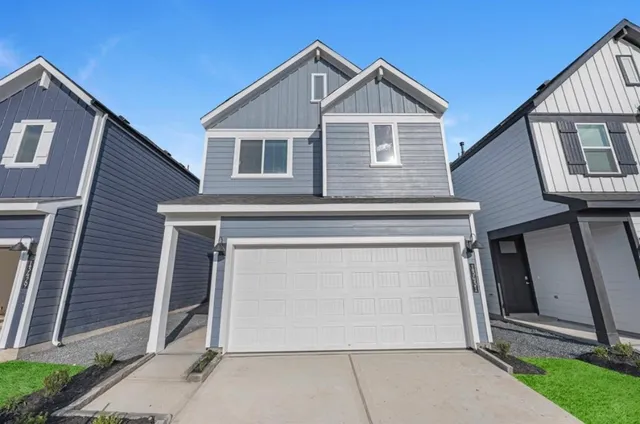a kitchen with a sink cabinets and wooden floor