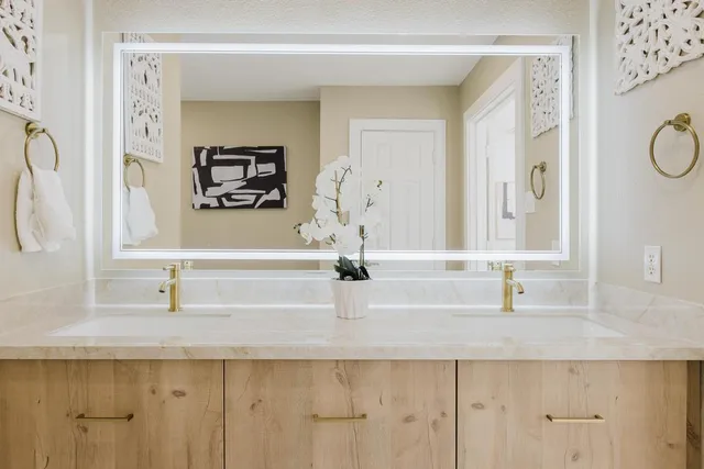 a bathroom with a sink and a mirror