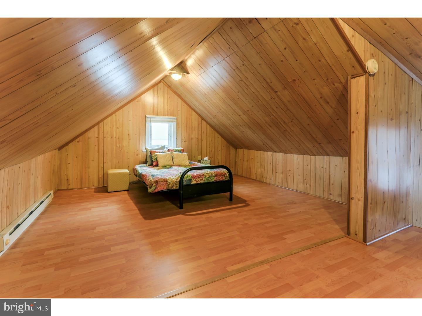 519 East Manoa Road Havertown, PA 19083 - Photo 17 of 20 a bedroom with a bed and a night stand