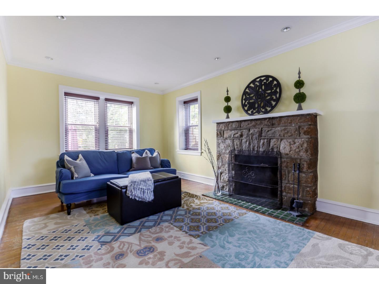 519 East Manoa Road Havertown, PA 19083 - Photo 6 of 20 a living room with furniture and a fireplace