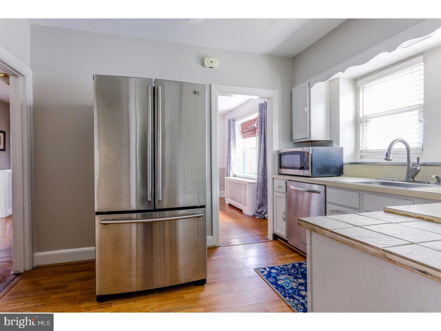 519 East Manoa Road Havertown, PA 19083 - Photo 9 of 20 a kitchen with granite countertop a refrigerator and a sink
