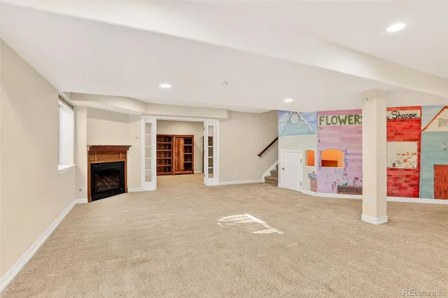 a view of a livingroom with an empty space and a fireplace