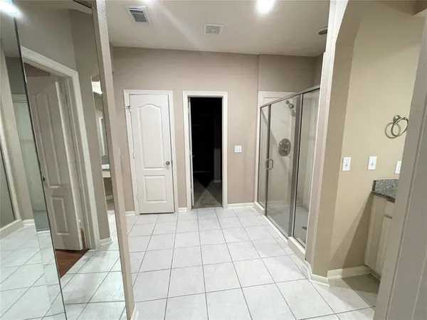 a view of a room with wooden floor and stairs