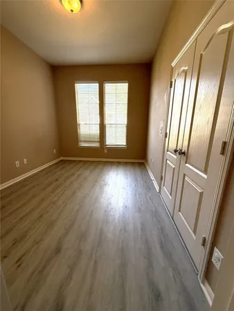 a bathroom with a toilet sink and shower