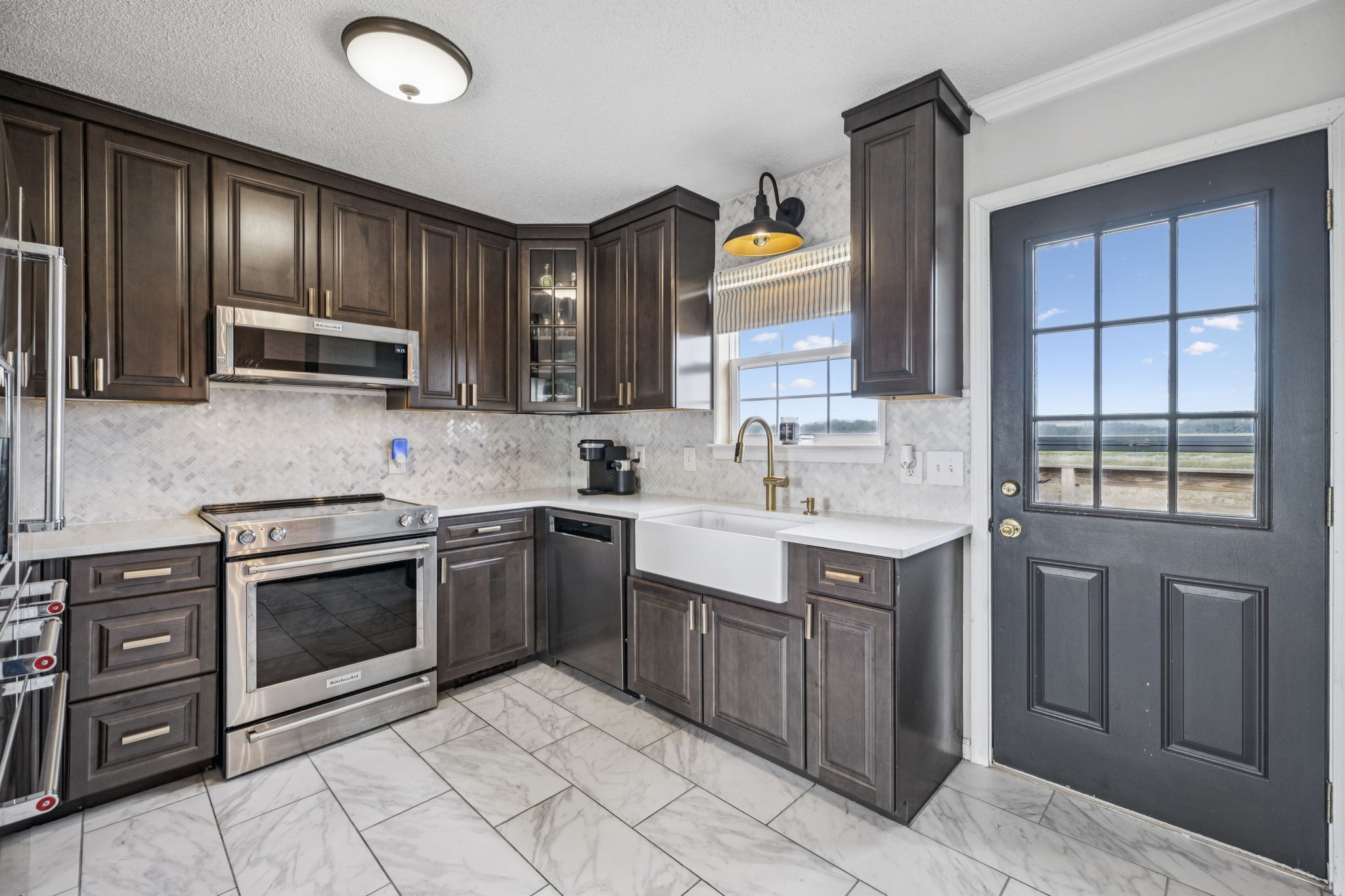 1547 Longview Road Unionville, TN 37180 - Photo 14 of 41 a kitchen with a sink stove and cabinets
