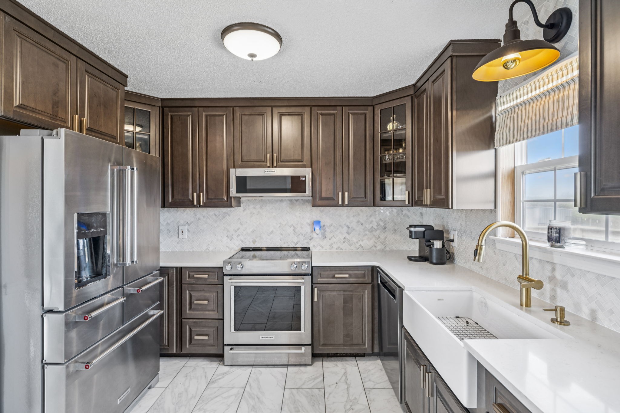 1547 Longview Road Unionville, TN 37180 - Photo 15 of 41 a kitchen with stainless steel appliances a stove sink and refrigerator