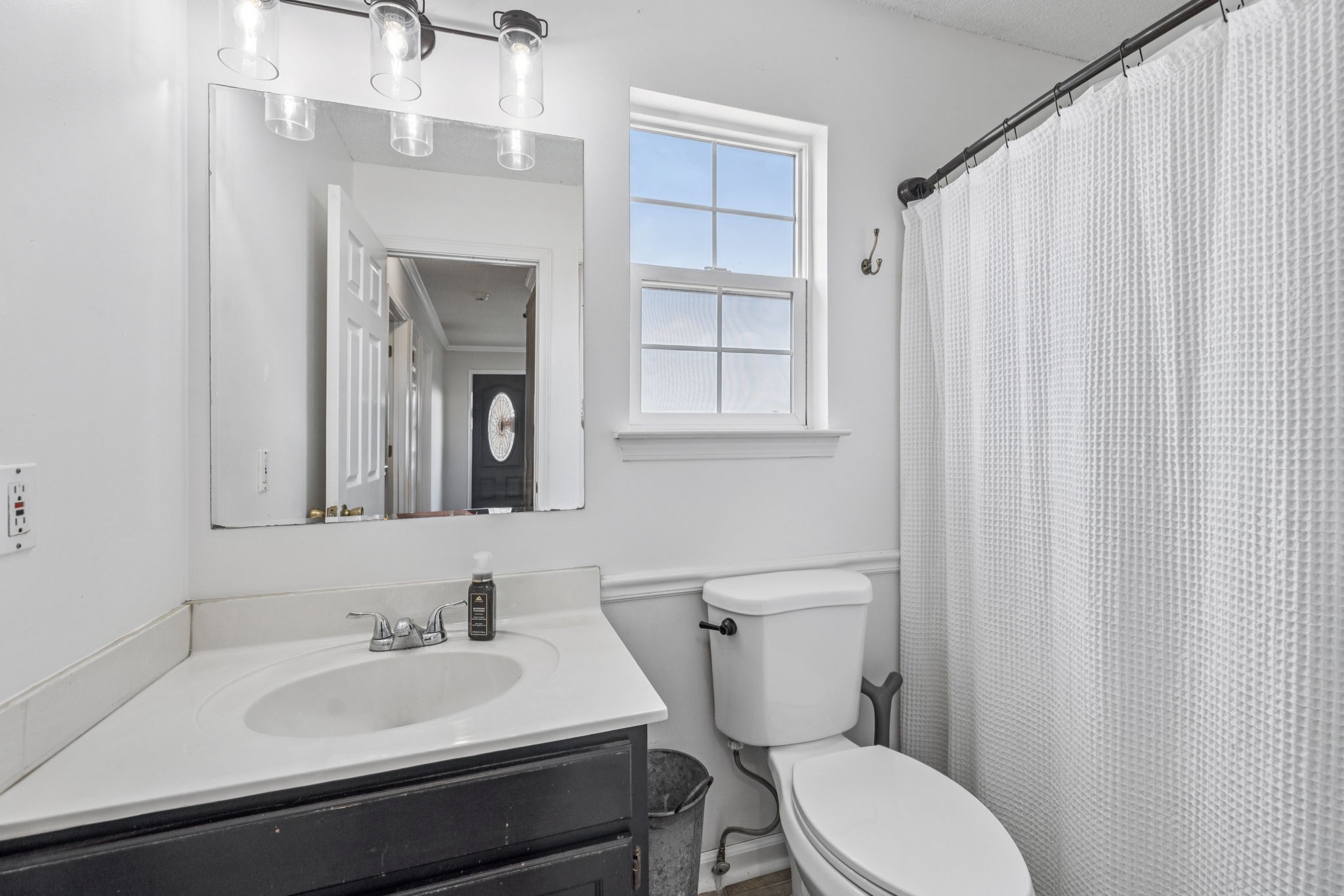 1547 Longview Road Unionville, TN 37180 - Photo 20 of 41 a bathroom with a toilet a sink and mirror