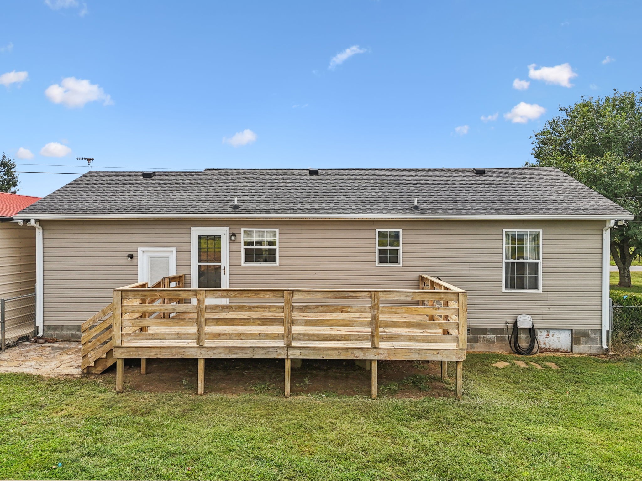 1547 Longview Road Unionville, TN 37180 - Photo 25 of 41 a view of a house with a chairs in patio
