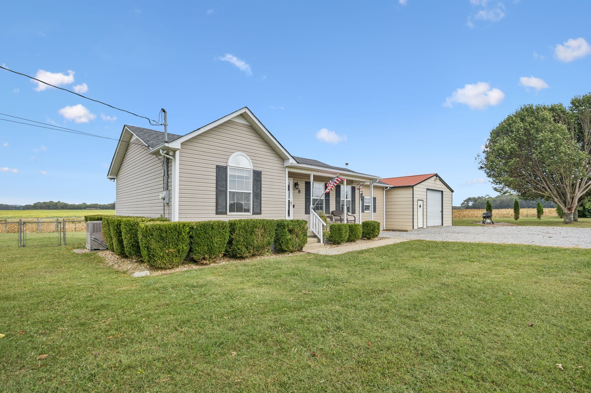 1547 Longview Road Unionville, TN 37180 - Photo 3 of 41 a front view of a house with a yard and garage
