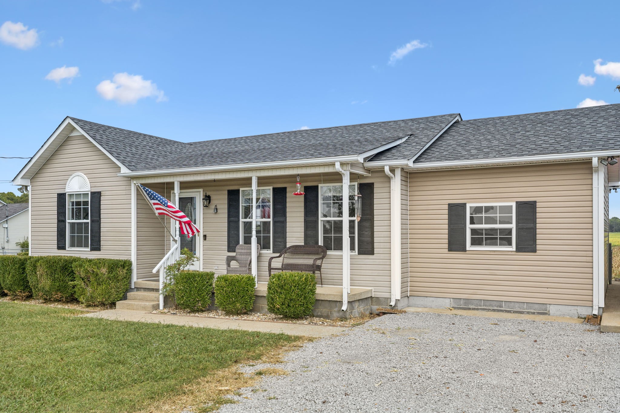1547 Longview Road Unionville, TN 37180 - Photo 4 of 41 a front view of a house with a yard and garage