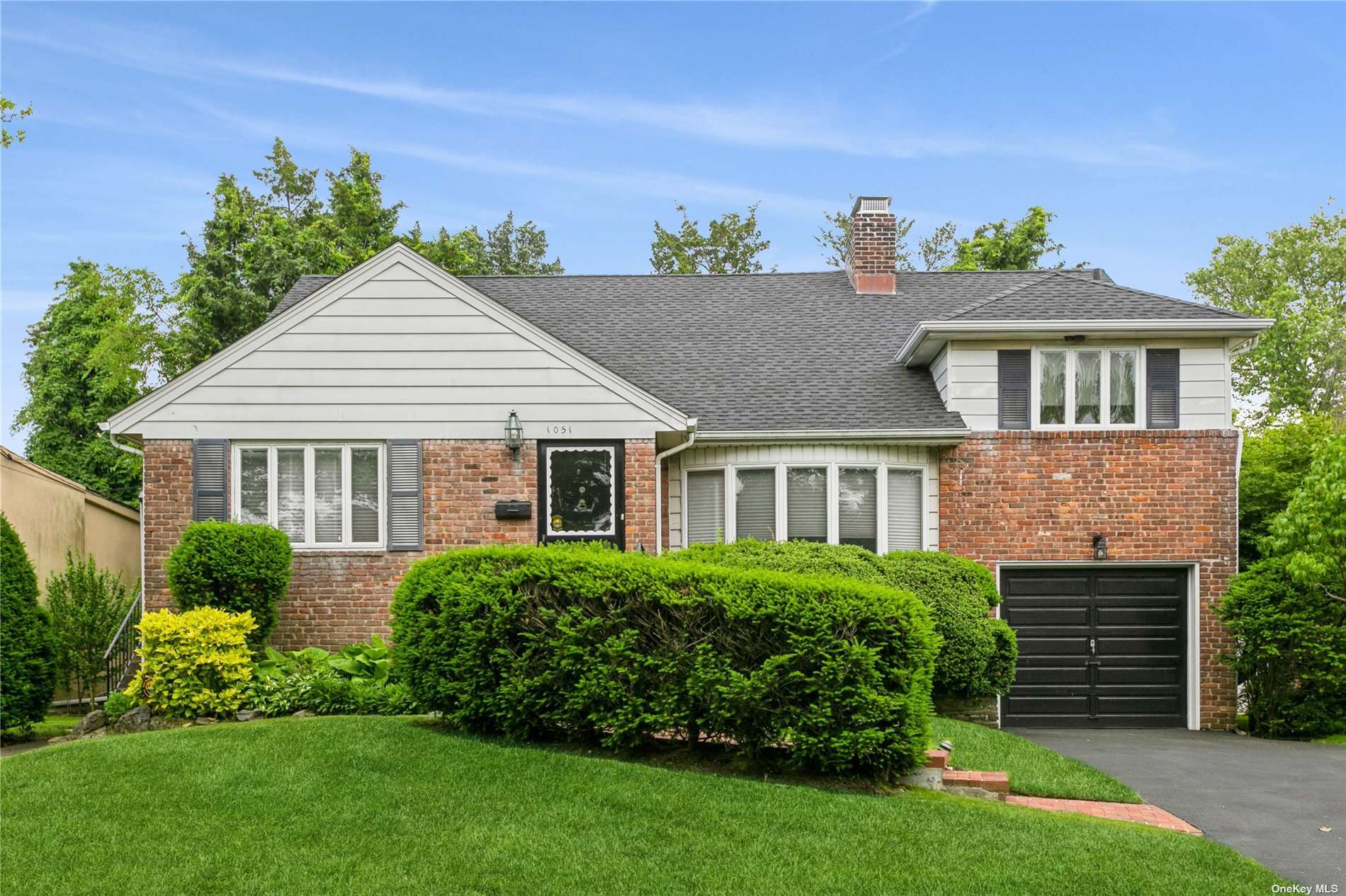 1051 Furth Road Valley Stream, NY 11581 - Photo 1 of 1 a front view of a house with a garden