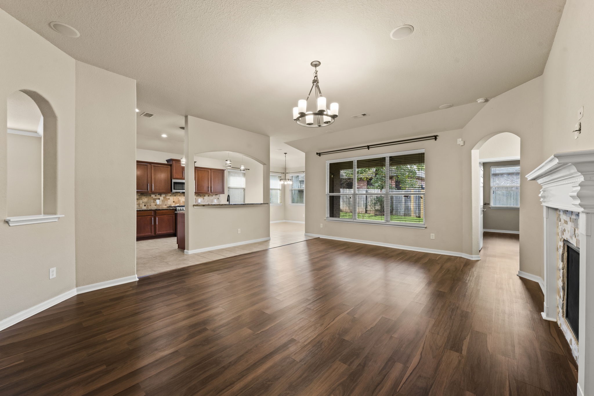 1906 Pagemill Lane Conroe, TX 77304 - Photo 11 of 41 a view of a kitchen with furniture and a fireplace