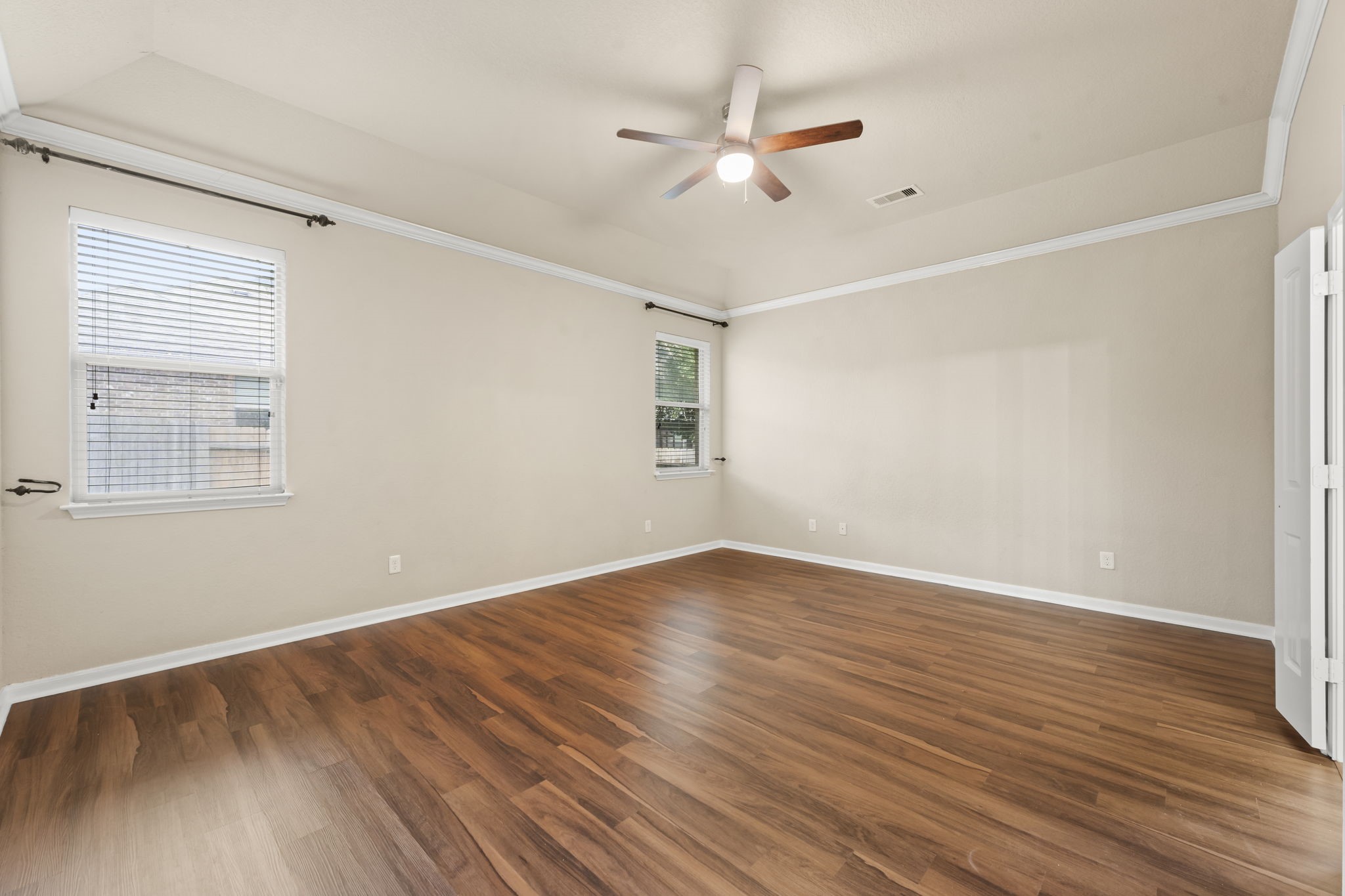 1906 Pagemill Lane Conroe, TX 77304 - Photo 22 of 41 a view of an empty room with wooden floor and a window