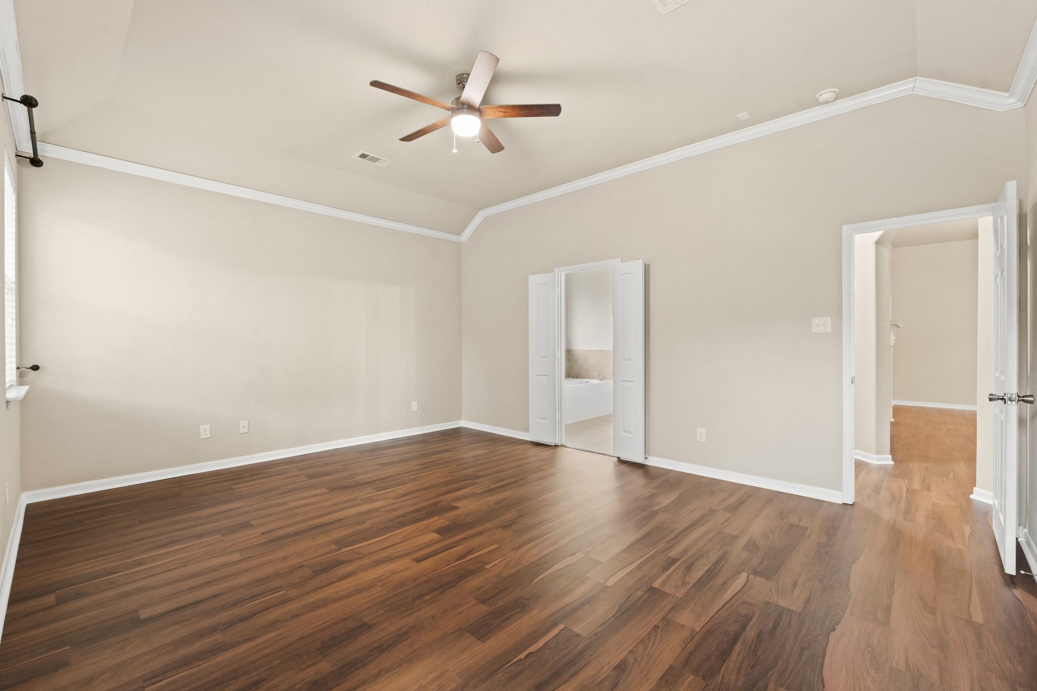 1906 Pagemill Lane Conroe, TX 77304 - Photo 24 of 41 a view of an empty room with wooden floor