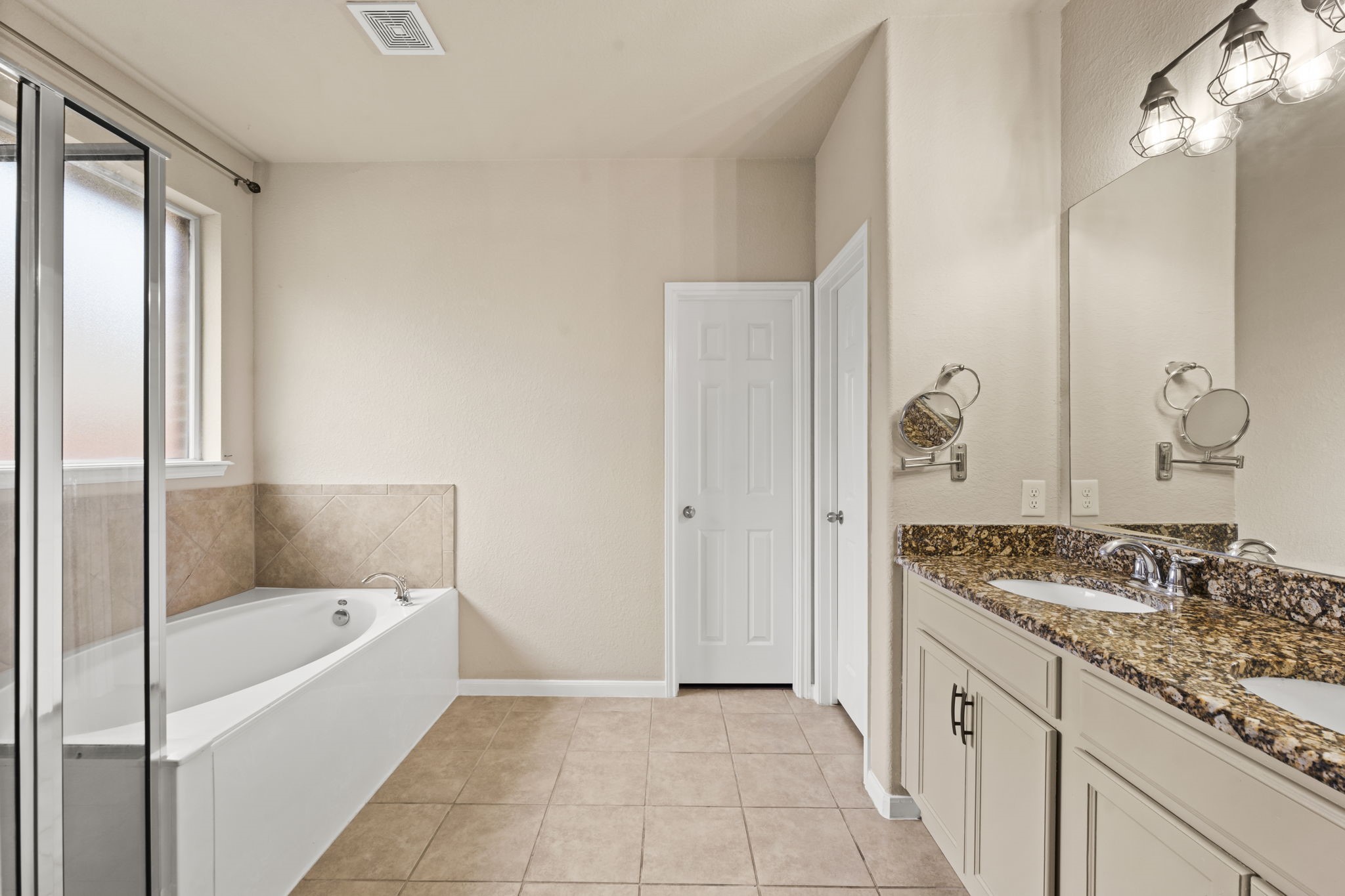 1906 Pagemill Lane Conroe, TX 77304 - Photo 25 of 41 a bathroom with a granite countertop sink and a bathtub