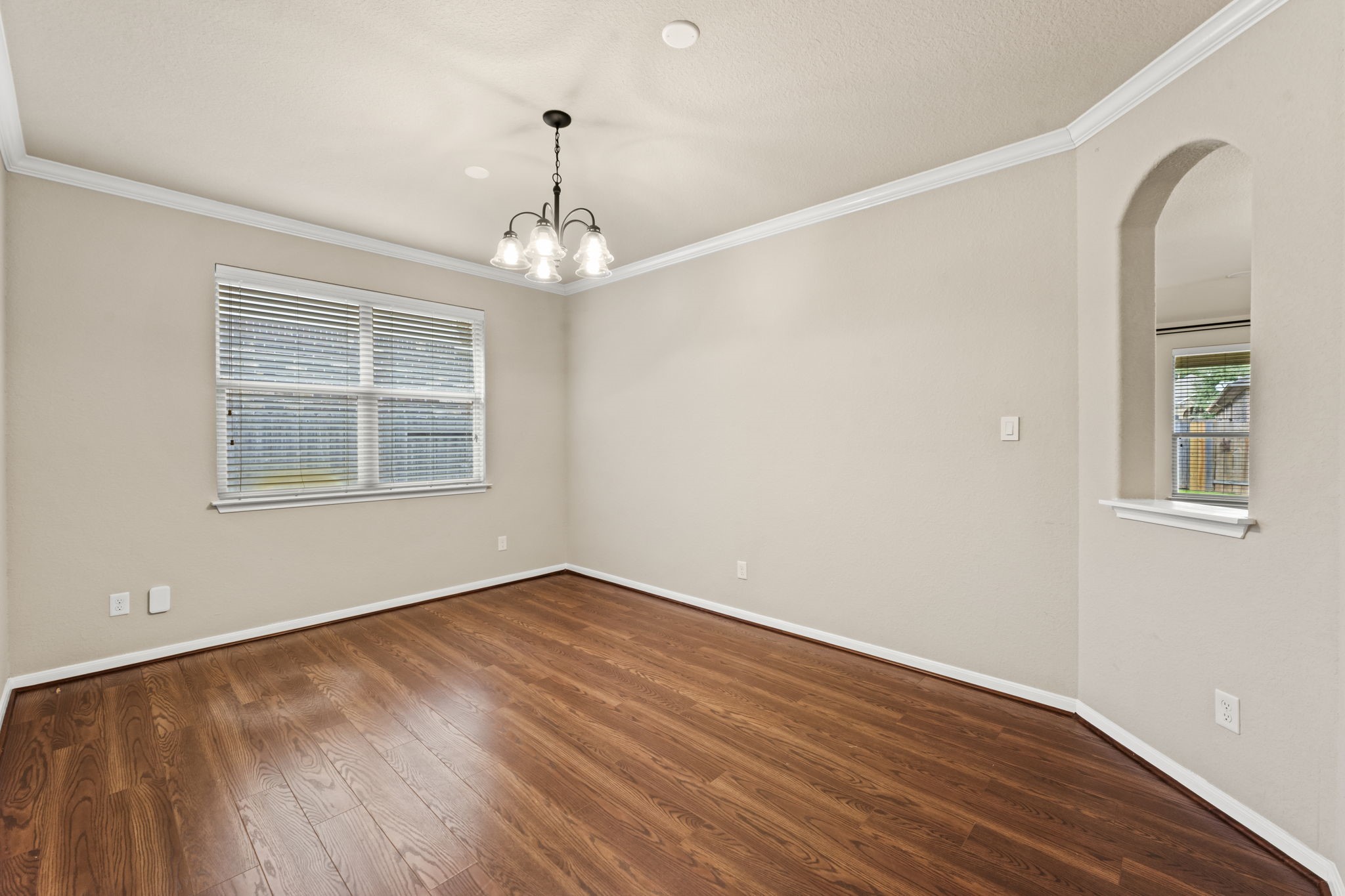 1906 Pagemill Lane Conroe, TX 77304 - Photo 28 of 41 a view of empty room with wooden floor and fan