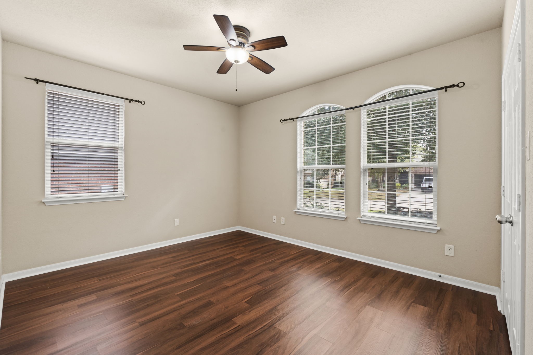 1906 Pagemill Lane Conroe, TX 77304 - Photo 30 of 41 a view of an empty room with wooden floor and a window
