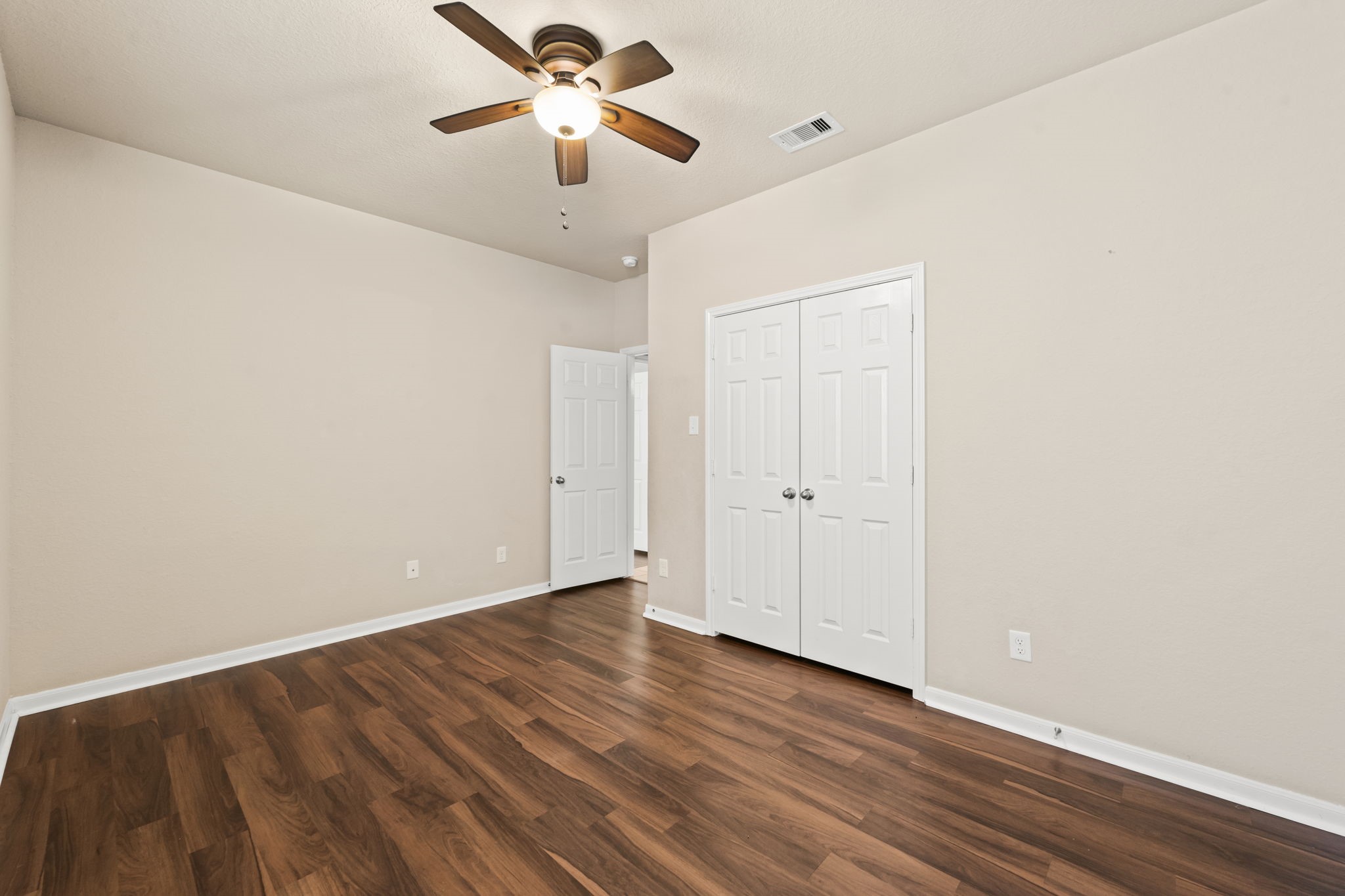 1906 Pagemill Lane Conroe, TX 77304 - Photo 33 of 41 wooden floor in an empty room