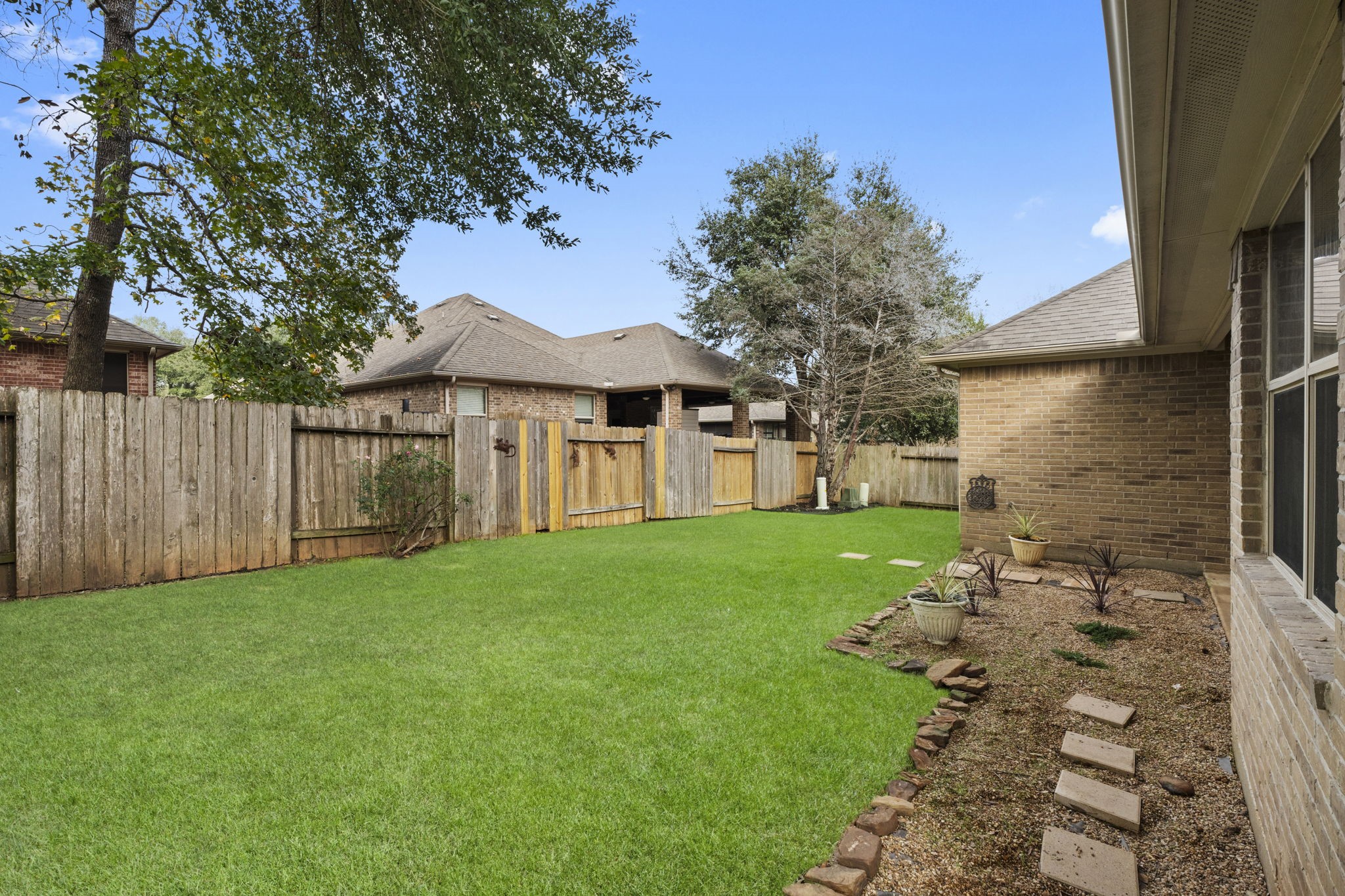 1906 Pagemill Lane Conroe, TX 77304 - Photo 37 of 41 a view of a house with a yard