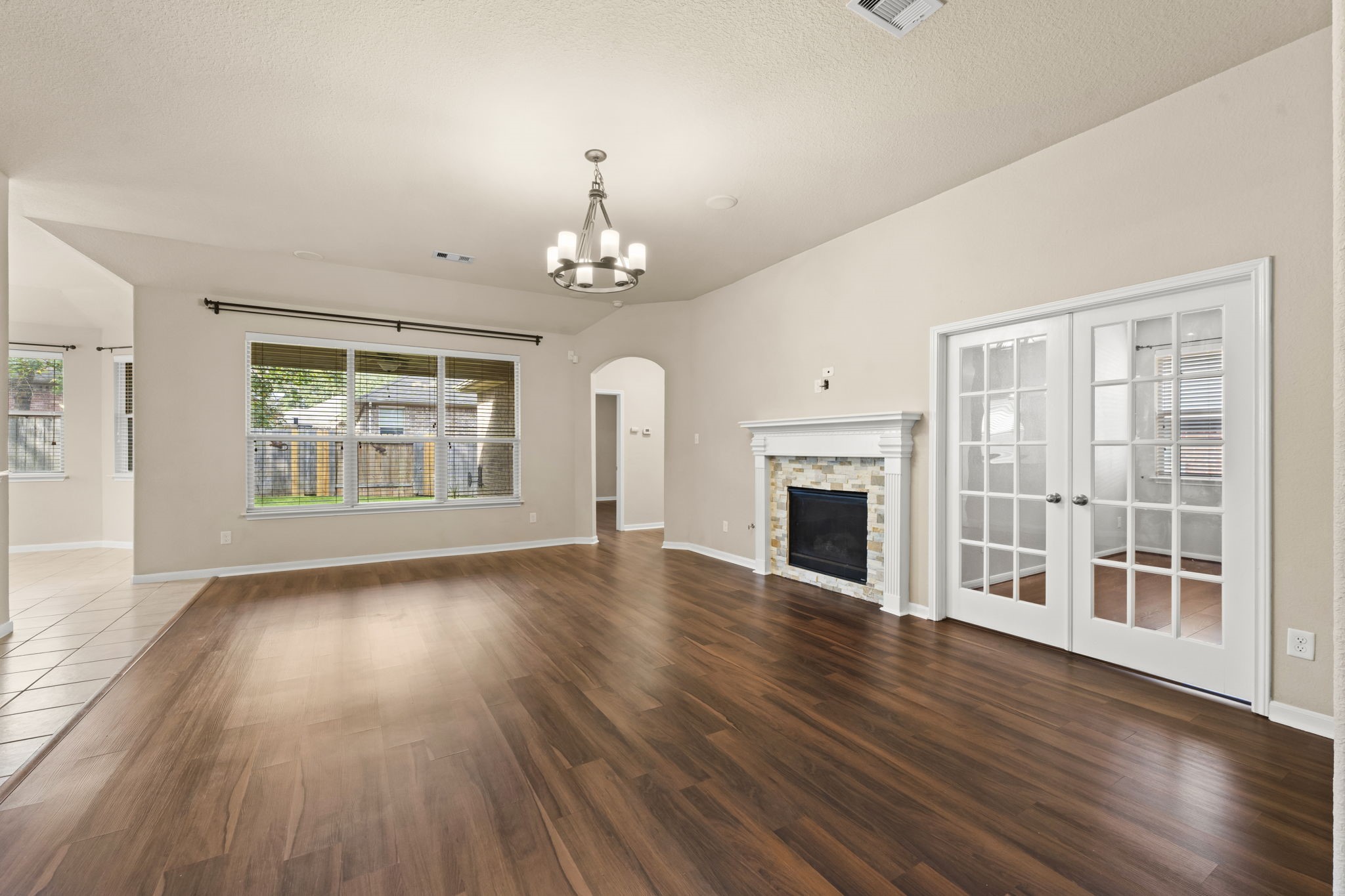 1906 Pagemill Lane Conroe, TX 77304 - Photo 8 of 41 a view of livingroom with furniture wooden floor fireplace and windows