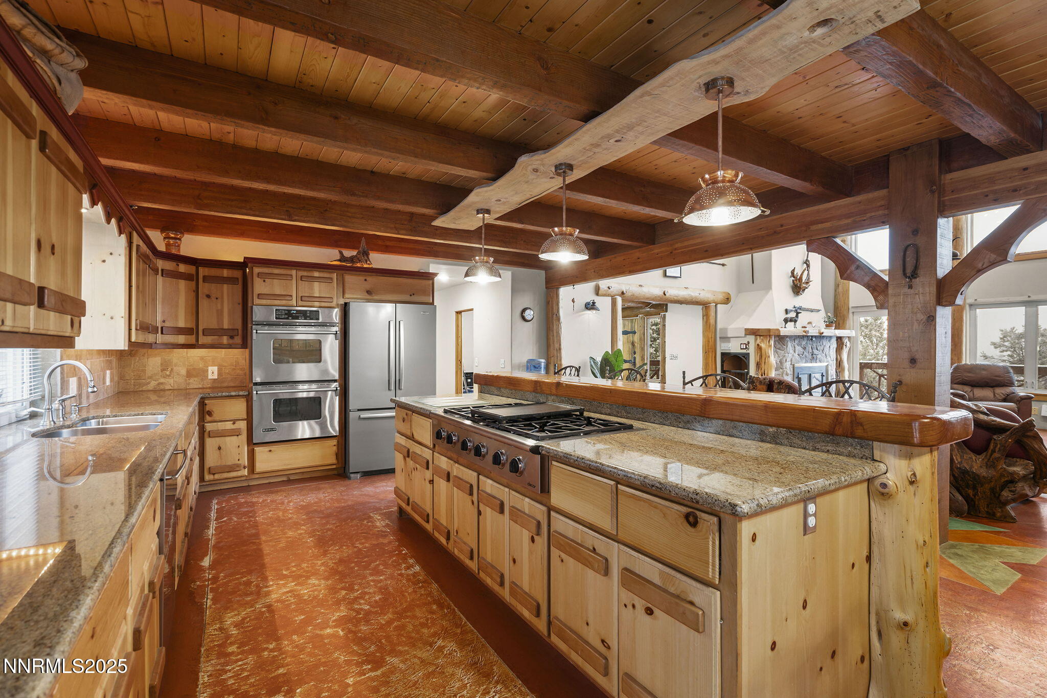 1610 Combination Road Reno, NV 89521 - Photo 15 of 64 a kitchen with stainless steel appliances granite countertop a stove and a refrigerator
