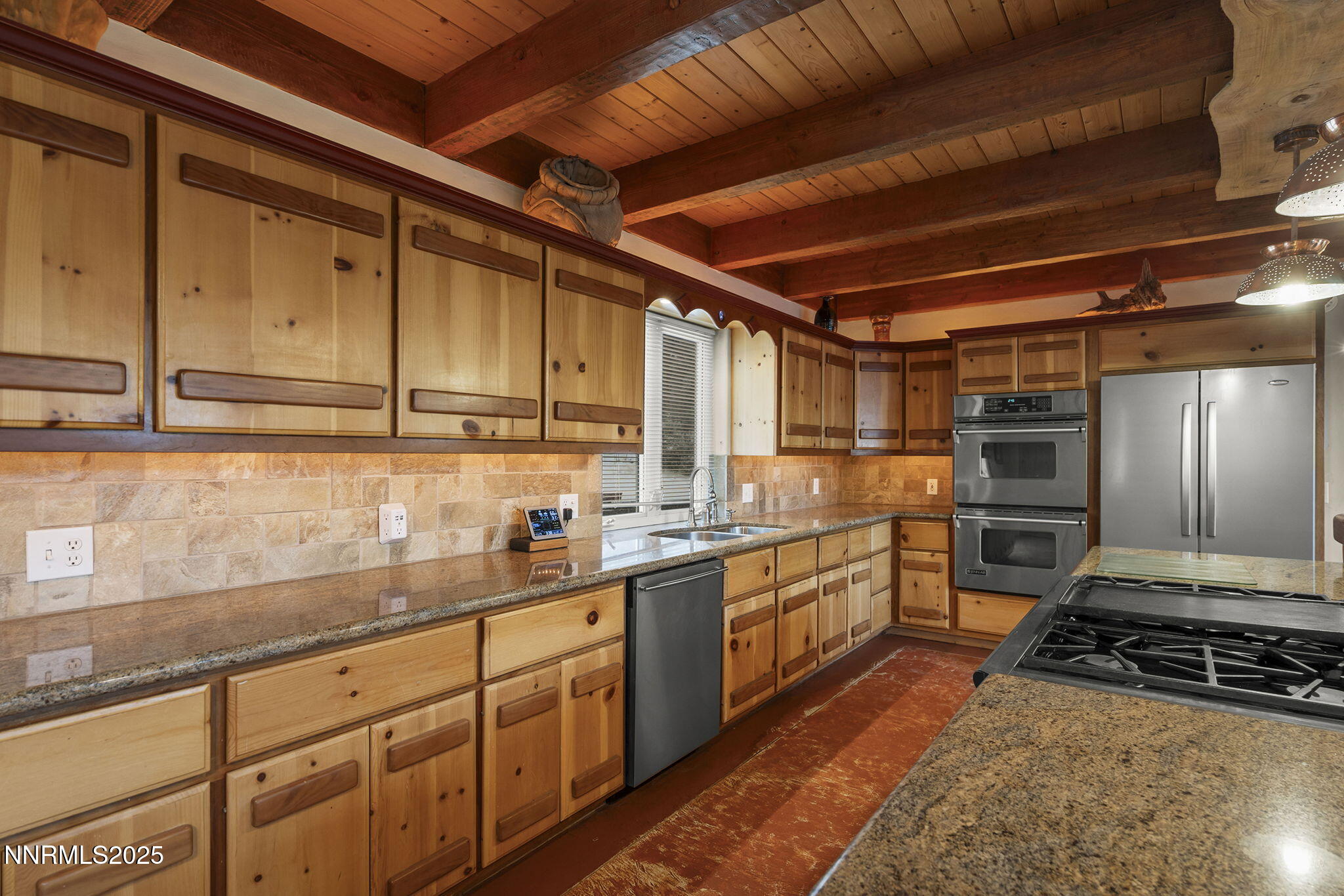 1610 Combination Road Reno, NV 89521 - Photo 16 of 64 a kitchen with sink window and stainless steel appliances