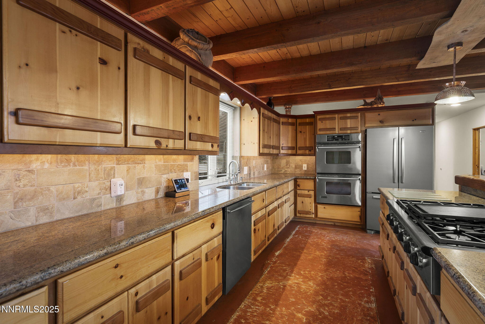 1610 Combination Road Reno, NV 89521 - Photo 17 of 64 a kitchen with refrigerator and cabinets