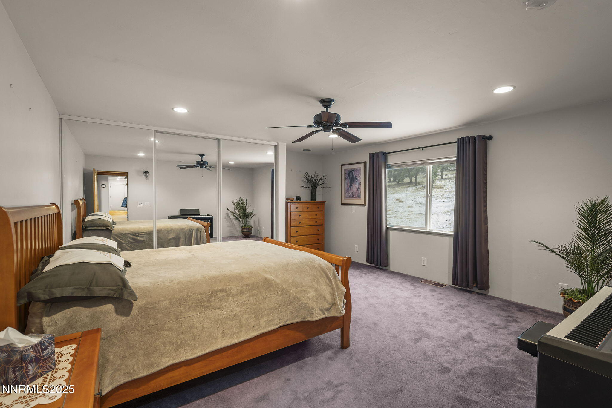 1610 Combination Road Reno, NV 89521 - Photo 19 of 64 a spacious bedroom with a bed and a couch