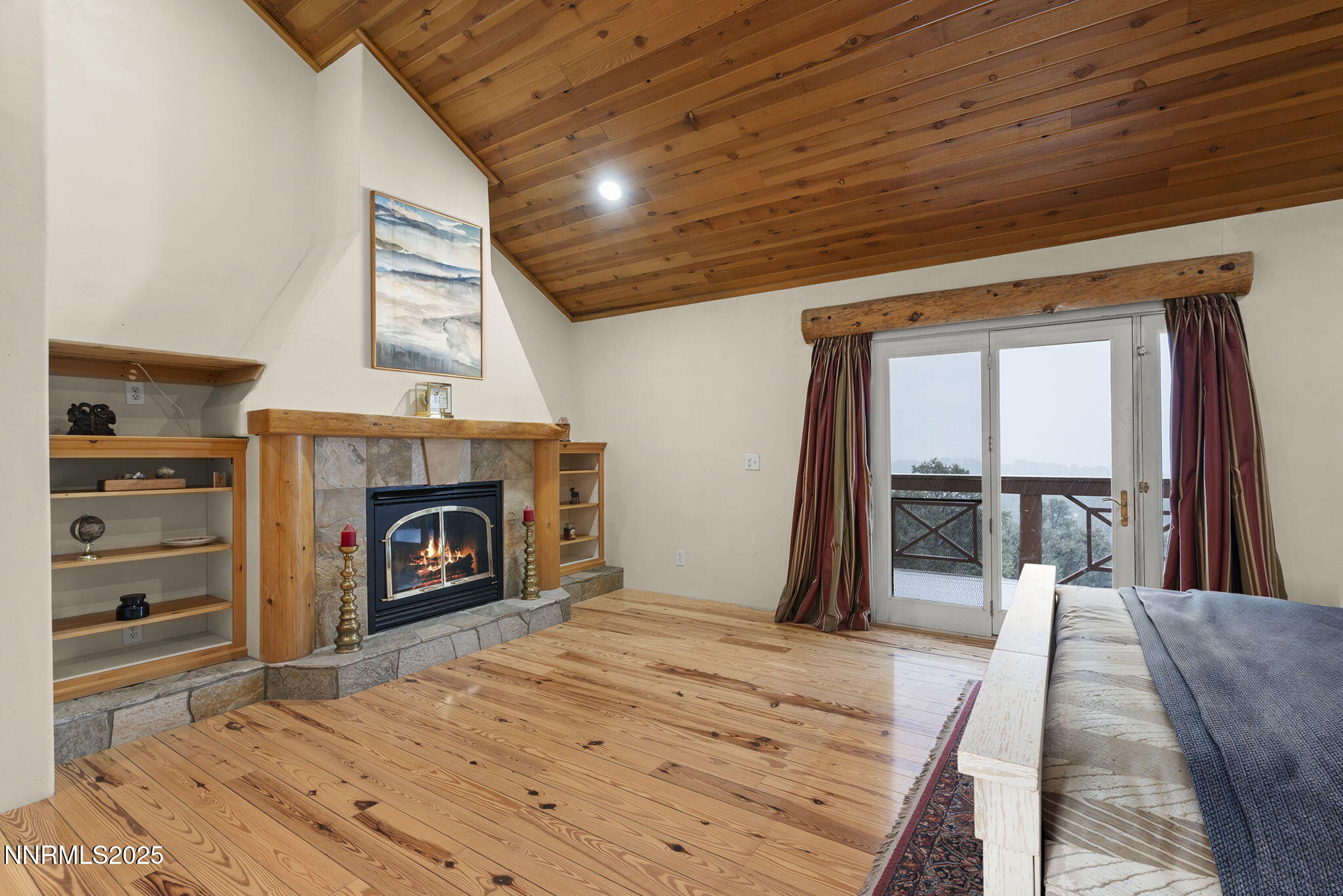 1610 Combination Road Reno, NV 89521 - Photo 25 of 64 a spacious bedroom with a bed and a fireplace