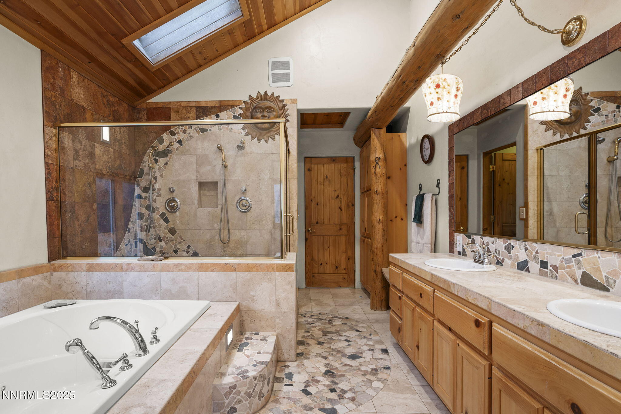 1610 Combination Road Reno, NV 89521 - Photo 30 of 64 a bathroom with a bathtub and a double vanity sink a mirror