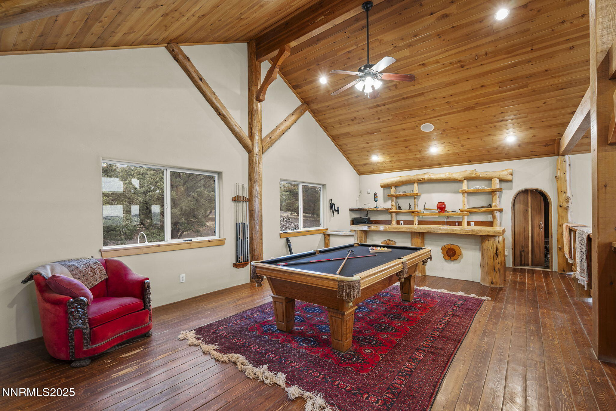 1610 Combination Road Reno, NV 89521 - Photo 33 of 64 a living room with furniture a flat screen tv and floor to ceiling window