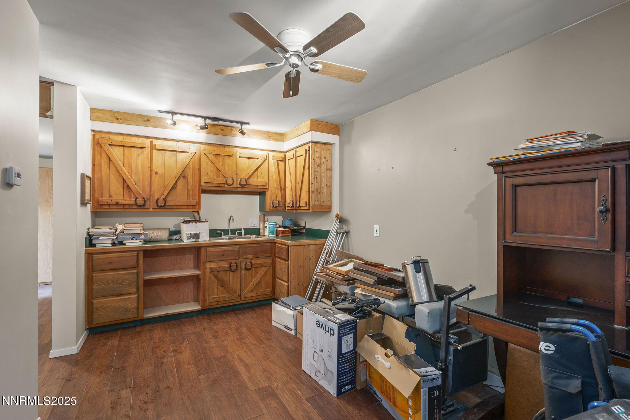 1610 Combination Road Reno, NV 89521 - Photo 40 of 64 a kitchen with a stove a sink and a refrigerator