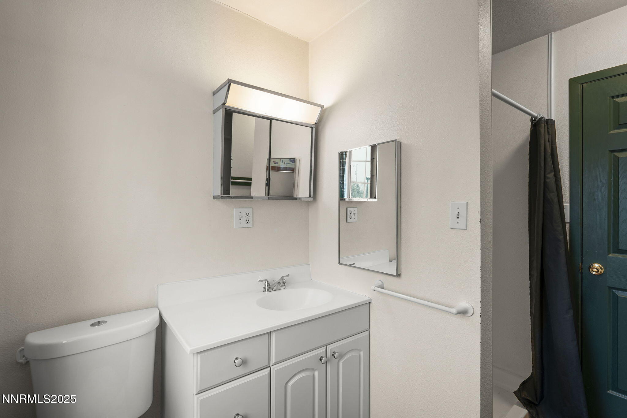 1610 Combination Road Reno, NV 89521 - Photo 41 of 64 a bathroom with a toilet sink and mirror