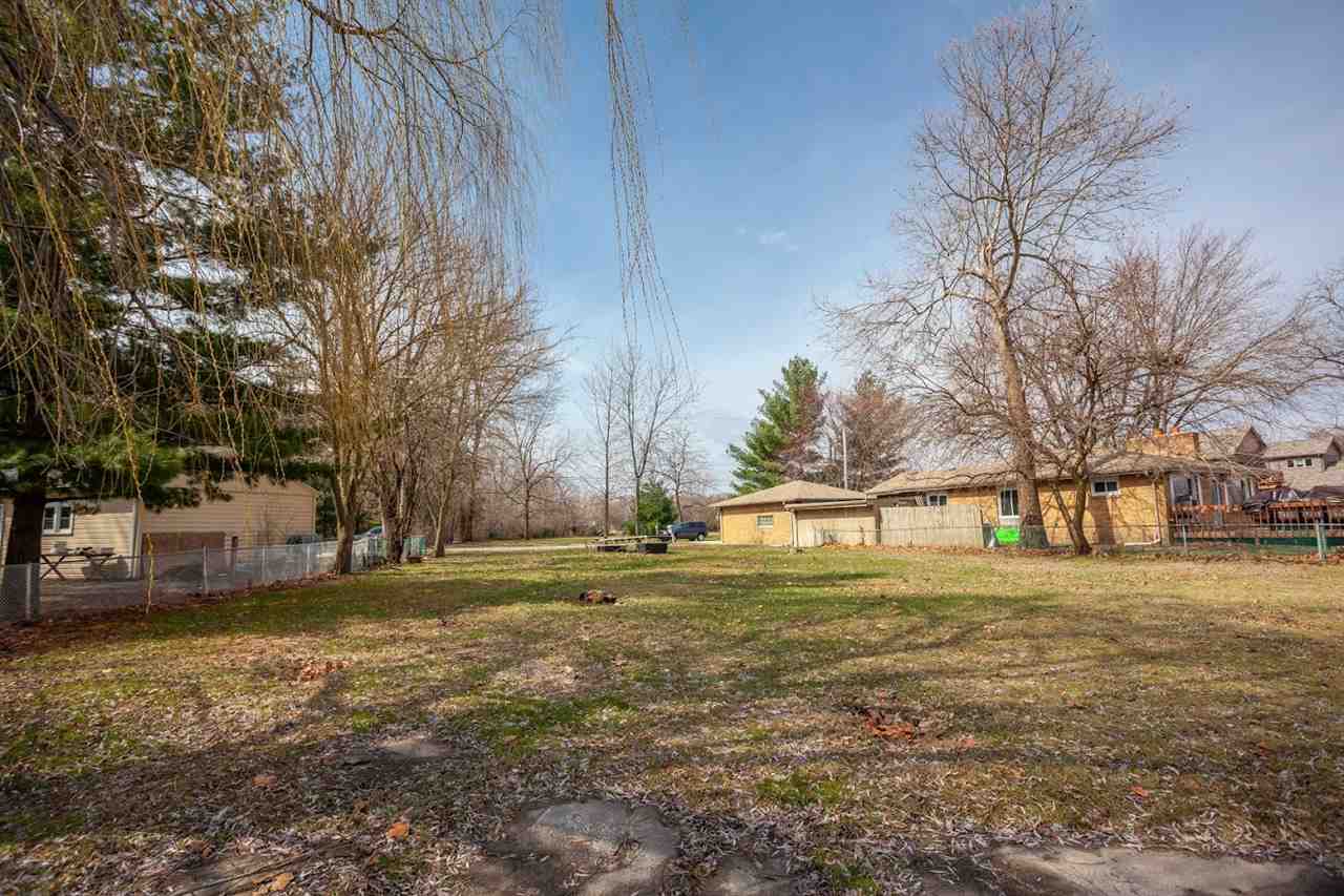 5065 Browns Beach Road Rockford, IL 61103 - Photo 3 of 9 a view of a yard with a trees