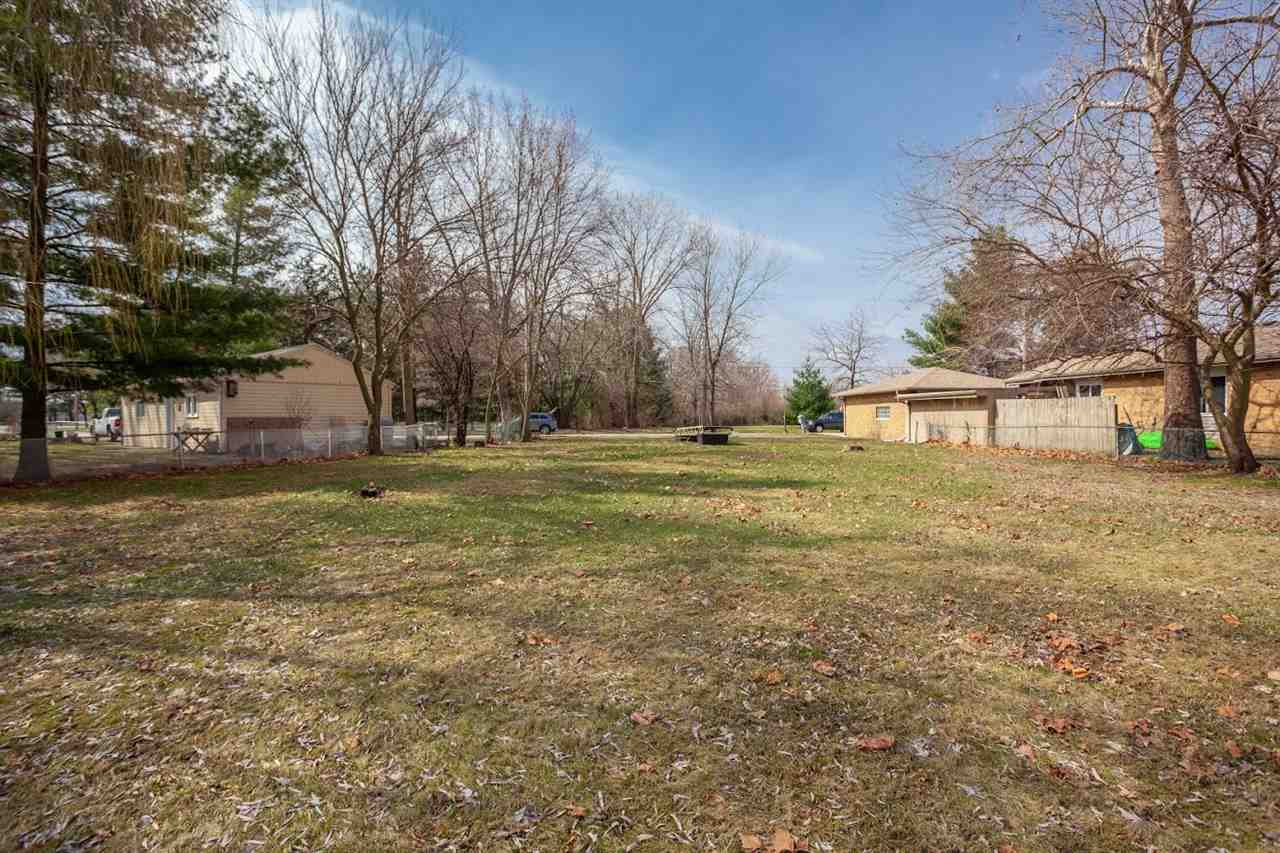 5065 Browns Beach Road Rockford, IL 61103 - Photo 4 of 9 a view of a field with trees