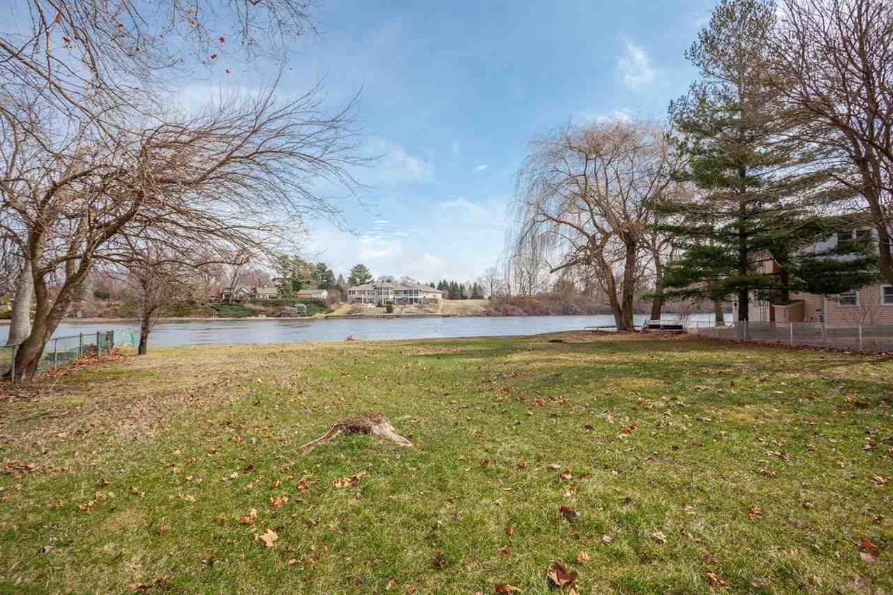 5065 Browns Beach Road Rockford, IL 61103 - Photo 8 of 9 a view of a yard with an trees