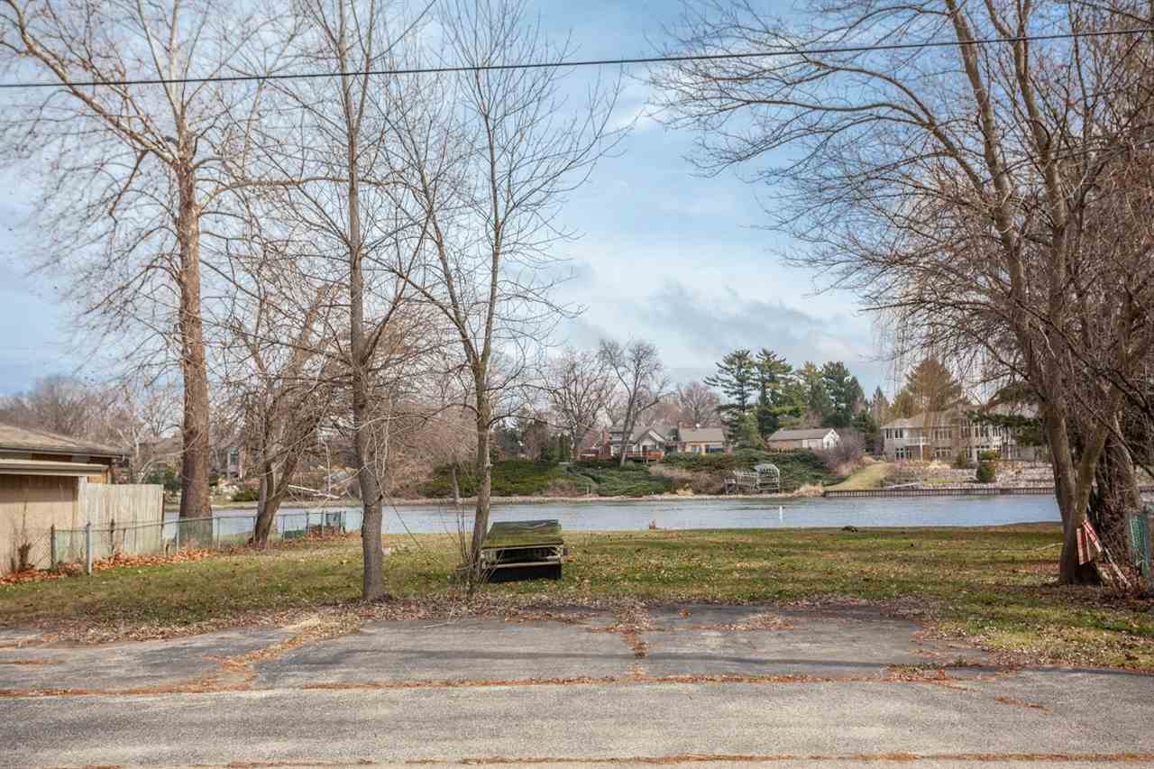 5065 Browns Beach Road Rockford, IL 61103 - Photo 9 of 9 a view of a yard with plants and trees