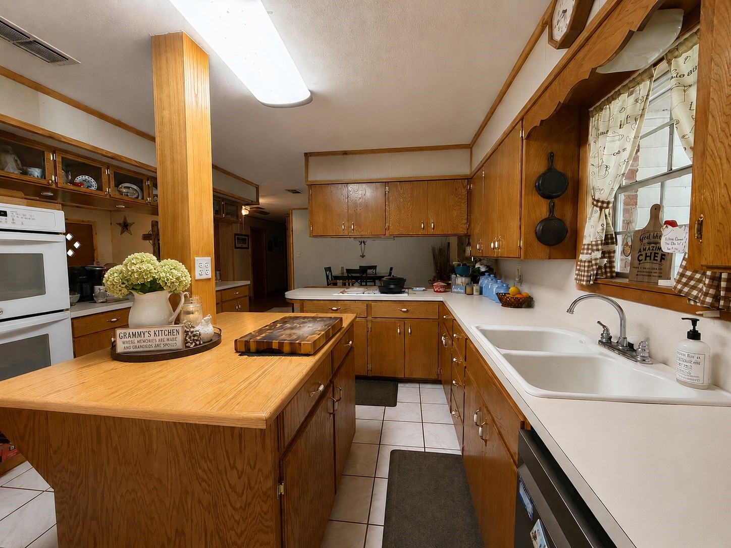 416 Division Street Jewett, TX 75846 - Photo 7 of 38 a kitchen with a sink and a refrigerator