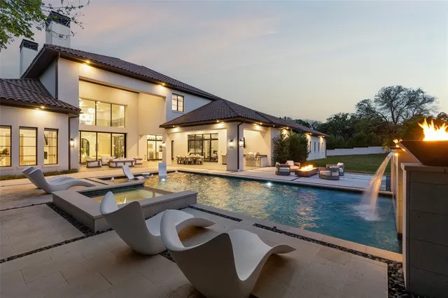 a view of a swimming pool and lounge chair