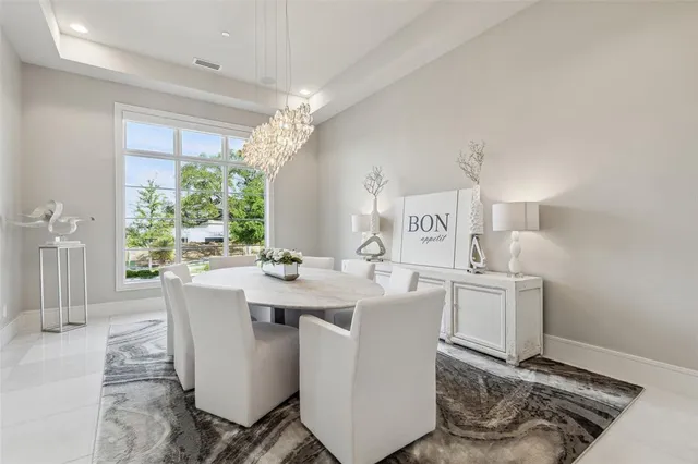 a view of a kitchen area with furniture and a chandelier