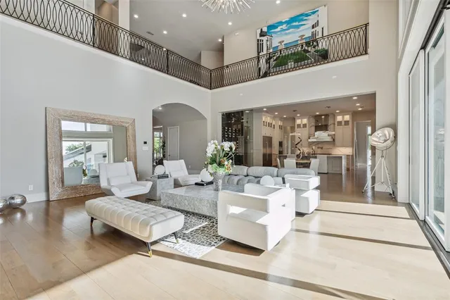 a living room with fireplace furniture and a large window