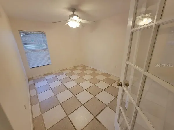 a view of a livingroom with wooden floor and white walls
