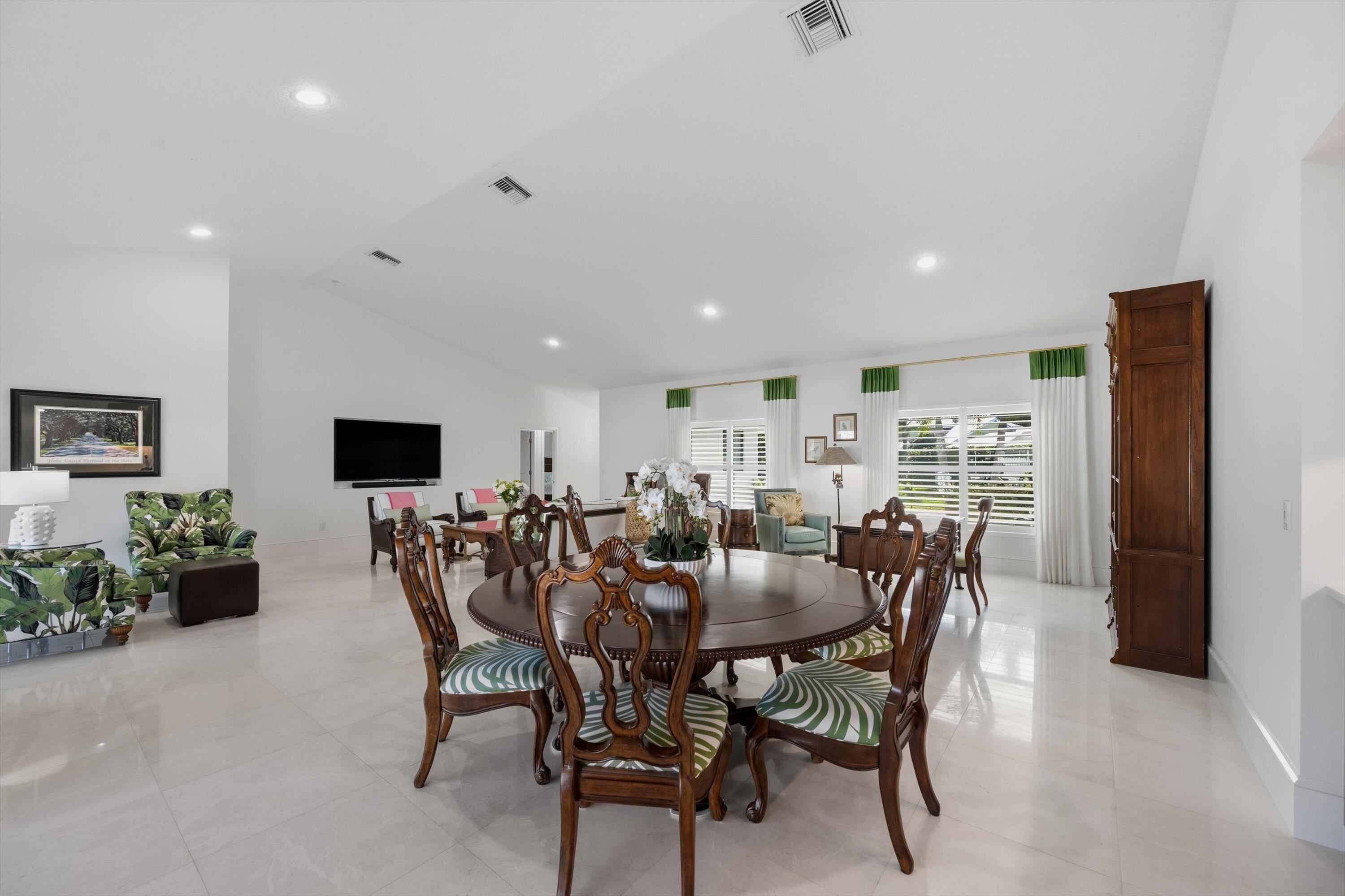 9039 Southeast Hawksbill Way Hobe Sound, FL 33455 - Photo 15 of 45 a view of a dining room with furniture
