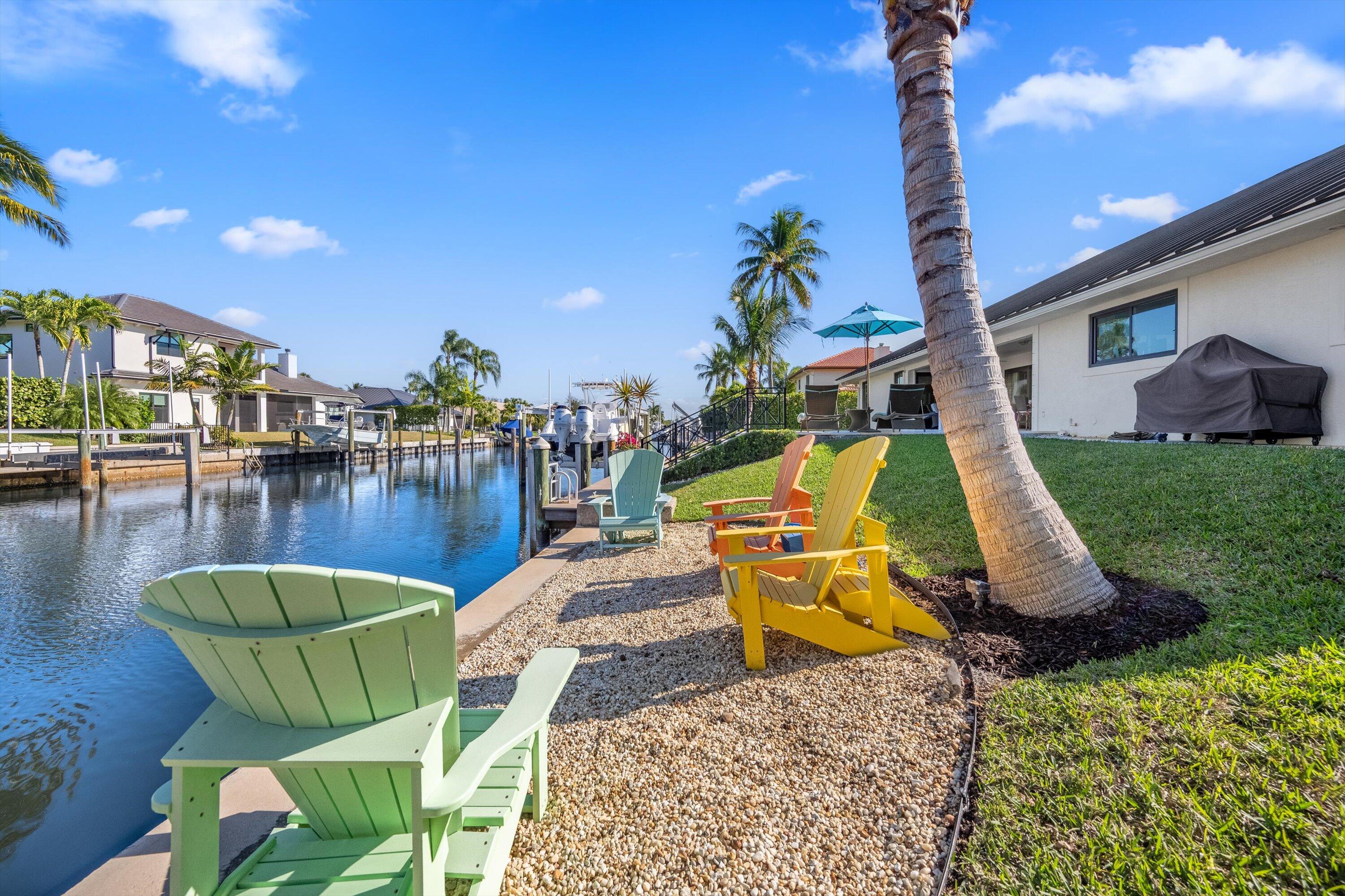 9039 Southeast Hawksbill Way Hobe Sound, FL 33455 - Photo 4 of 45 a view of outdoor space with seating area