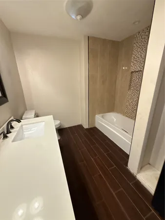 a bathroom with a sink and toilet