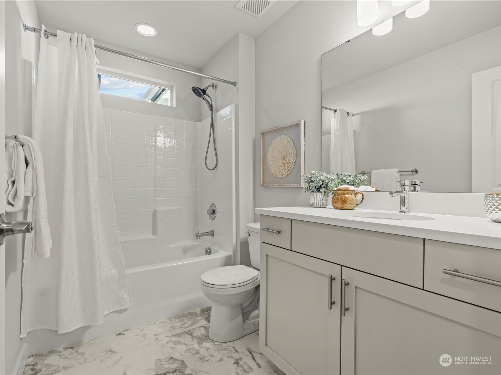 23831 5th Avenue Southeast, Unit B Bothell, WA 98021 - Photo 23 of 32 a bathroom with a sink toilet a shower and a mirror
