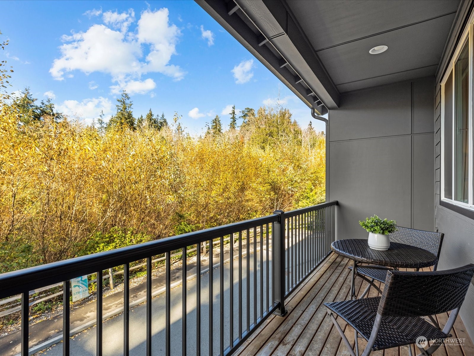 23831 5th Avenue Southeast, Unit B Bothell, WA 98021 - Photo 10 of 32 a view of a balcony with wooden floor and outdoor space