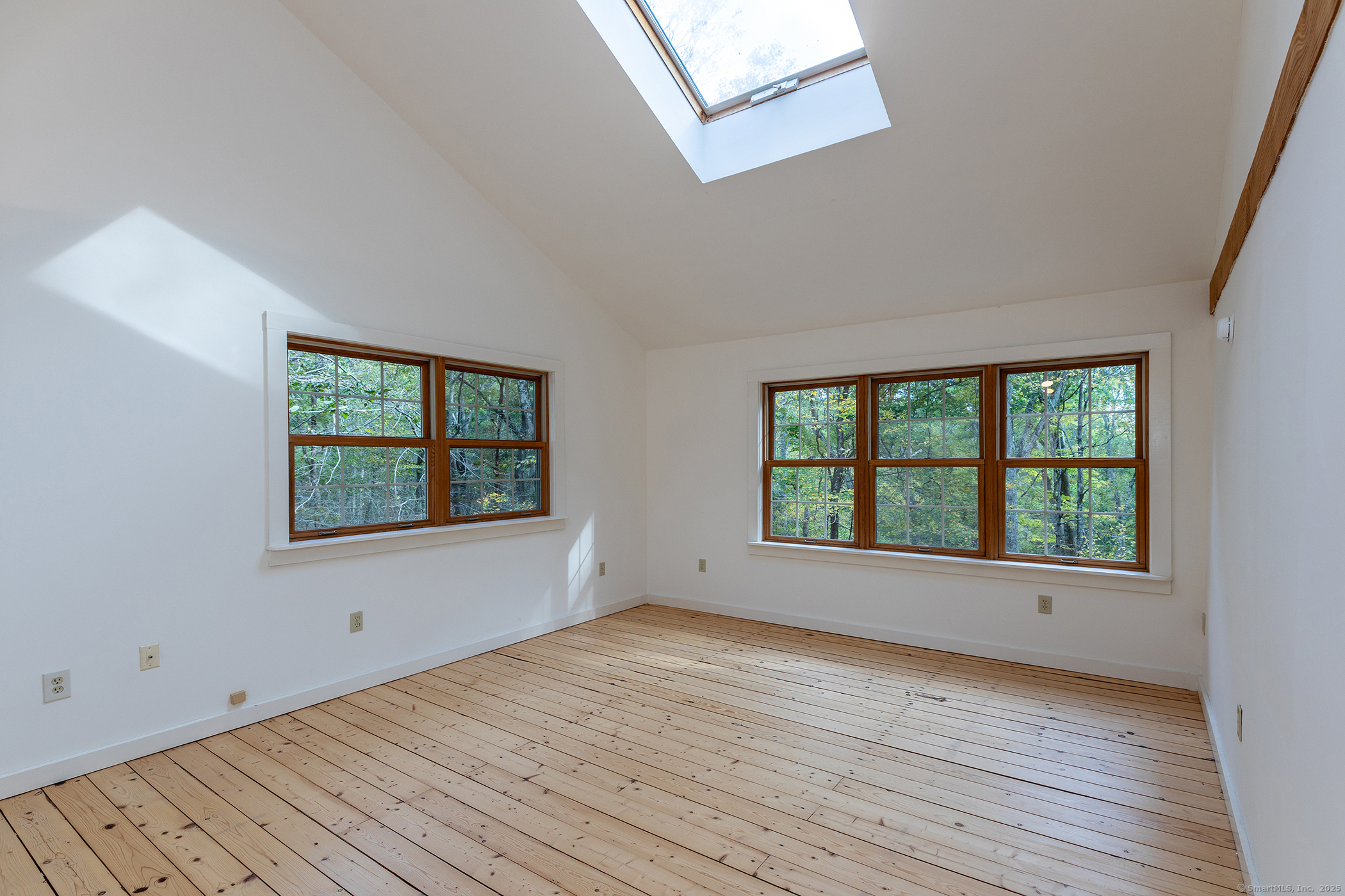 38 West Mountain Lane Roxbury, CT 06783 - Photo 13 of 26 an empty room with wooden floor and windows