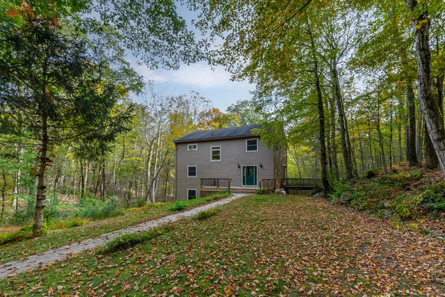 a house view with a backyard space