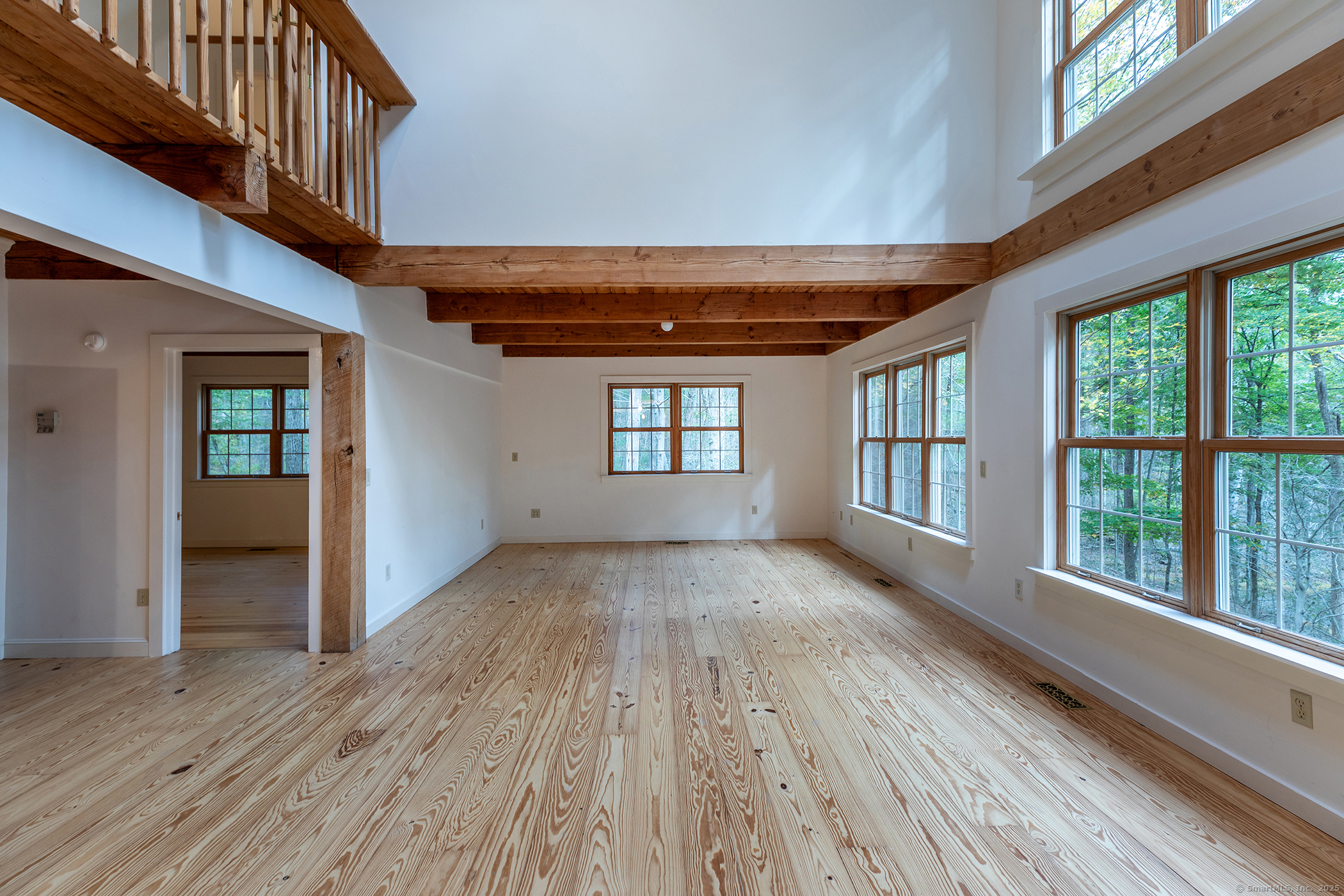 38 West Mountain Lane Roxbury, CT 06783 - Photo 6 of 26 wooden floor in an empty room with a window
